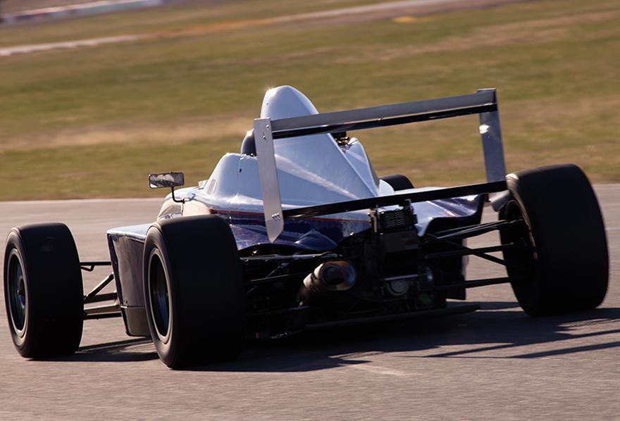 Rear view of Giuliano's Formula BMW on track